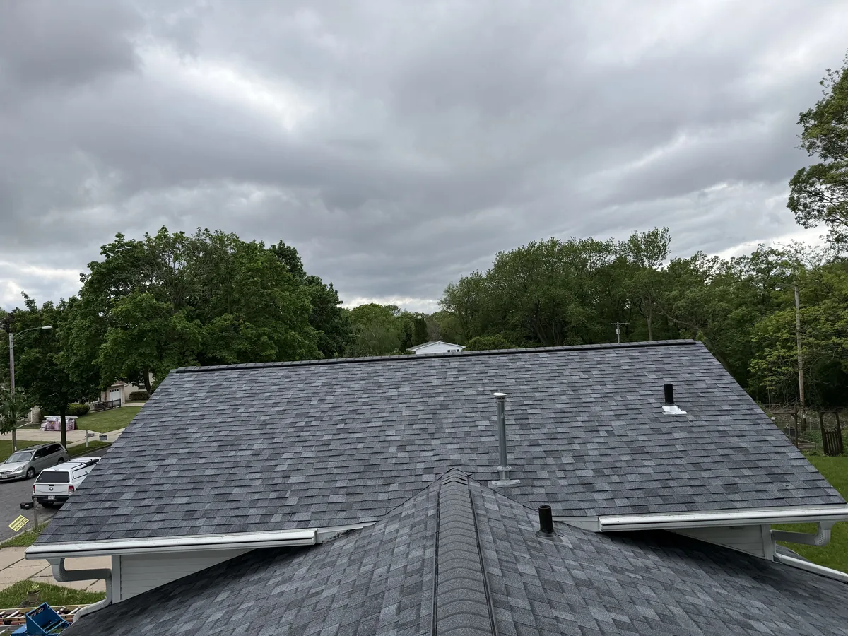Gray architectural shingle roof with a ridge vent