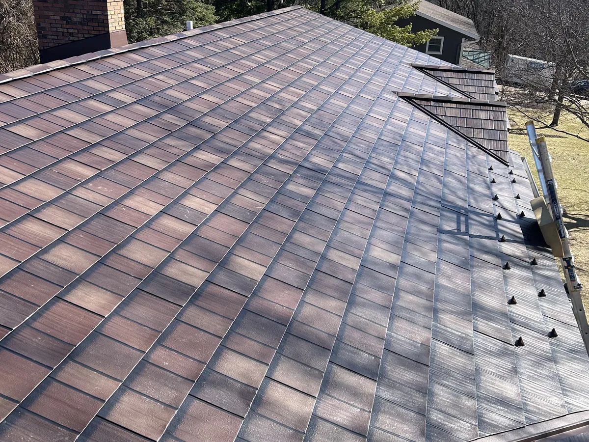 Brown architectural shingle roof on a hip roof home