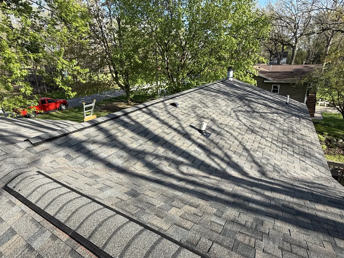 Charcoal gray shingle roof across a full roof plane